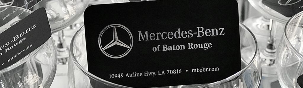 Black buisness card with silver stamped foil. 